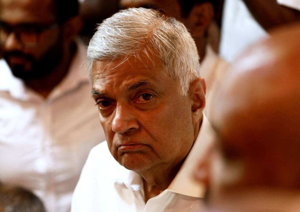 Sri Lankan Prime Minister Ranil Wickremesinghe arrives at a Buddhist temple after his swearing-in ceremony amid the country's economic crisis, in Colombo May 12, 2022. — Reuters pic