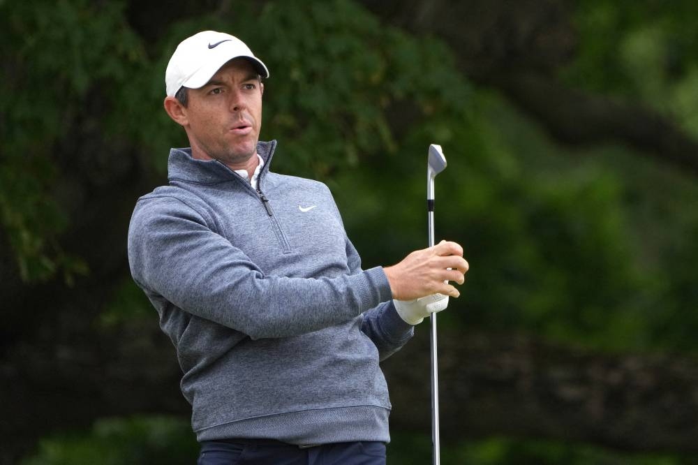 Rory McIlroy watches his shot from the sixth tee during the third round of the US Open golf tournament in Brookline June 18, 2022. — Reuters pic