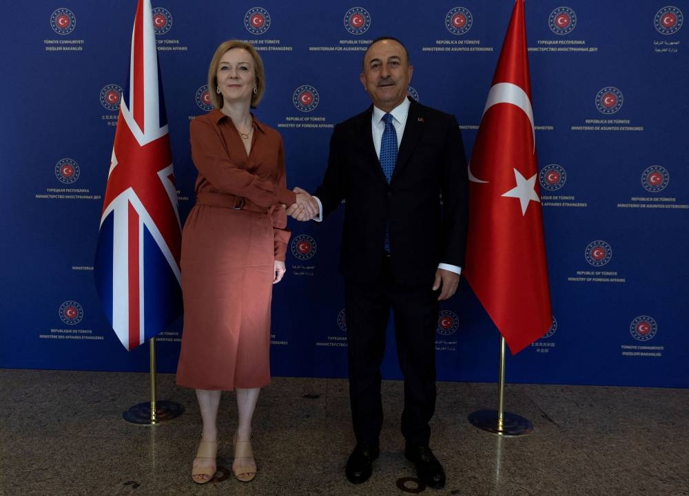 Turkish Foreign Minister Mevlut Cavusoglu meets British Foreign Secretary Liz Truss in Ankara, Turkey, June 23, 2022. — Reuters pic