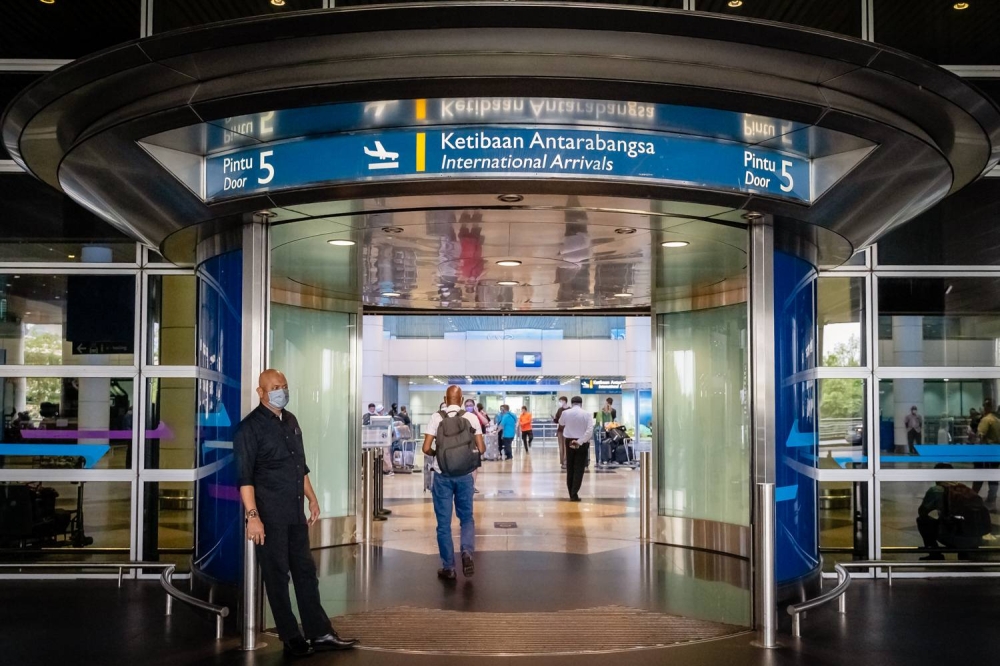 A view of passengers entering the arrival hall at the Kuala Lumpur International Airport in Sepang April 1, 2022. — Picture by Devan Manuel