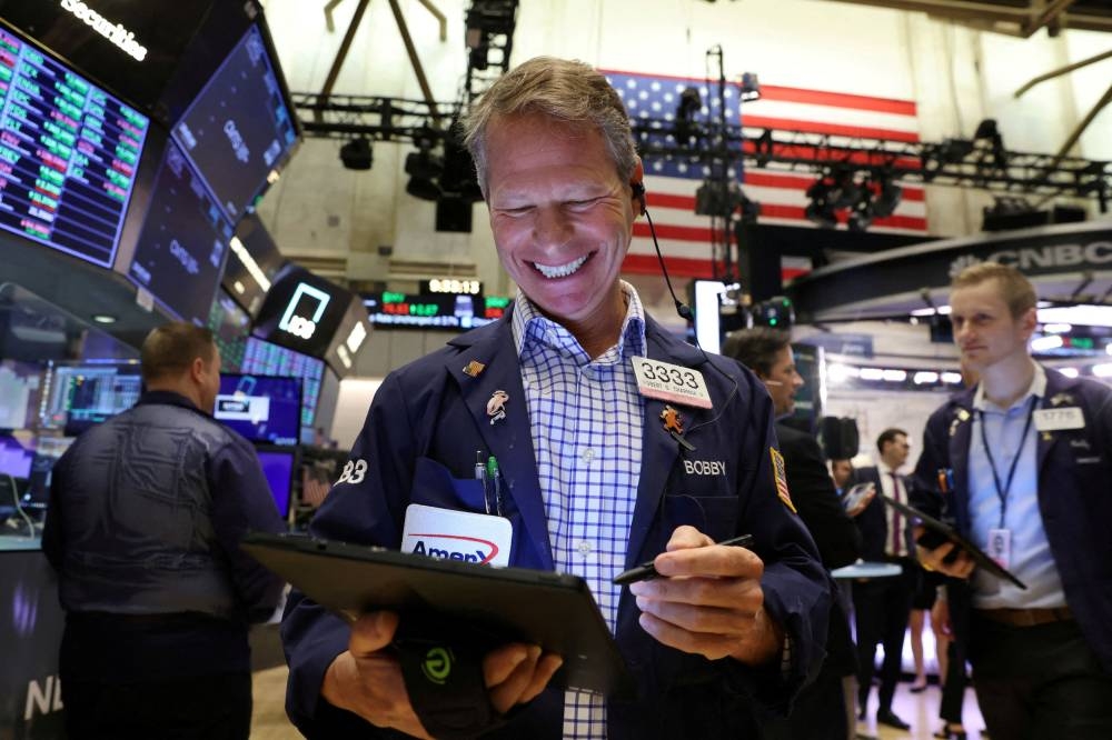 Traders work on the trading floor at the New York Stock Exchange (NYSE) in Manhattan, New York City May 20, 2022. — Reuters pic