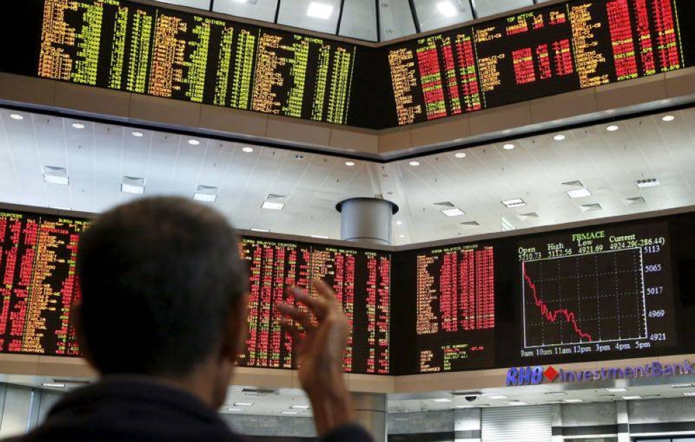 An investor monitors share market prices at a brokerage firm in Kuala Lumpur, Malaysia, August 24, 2015. — Reuters pic