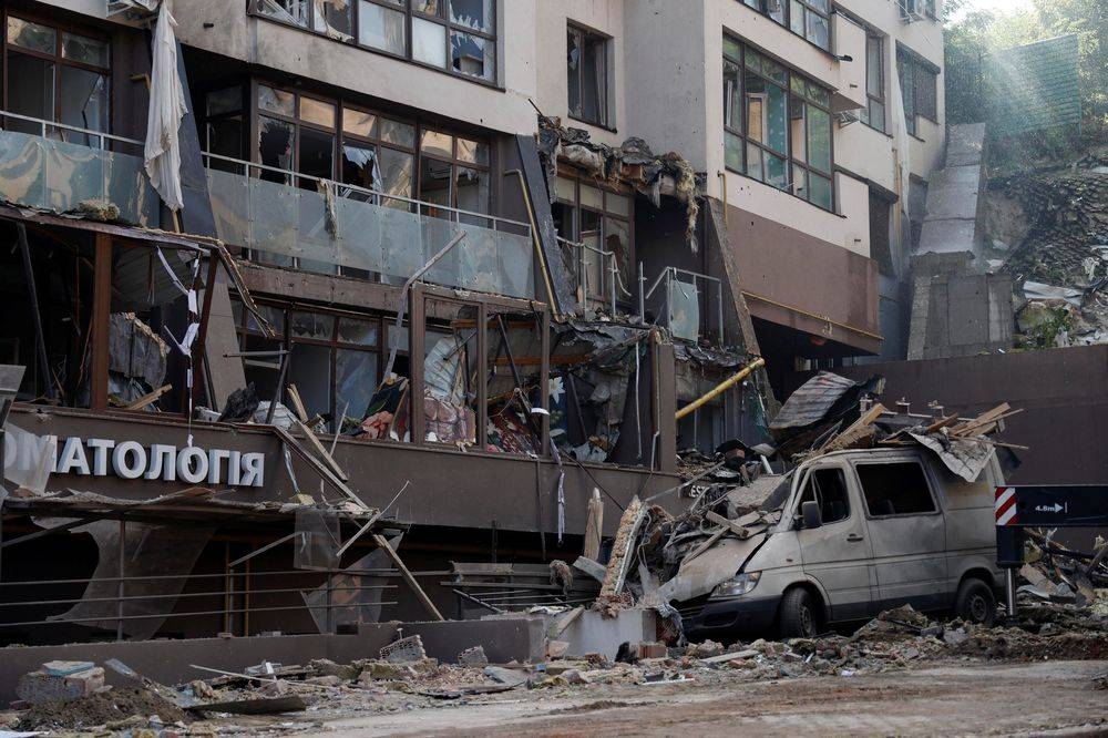 A damaged vehicle is seen outside a residential building hit by a Russian missile strike, as Russia's attack on Ukraine continues, in Kyiv, Ukraine June 26, 2022. — Reuters pic