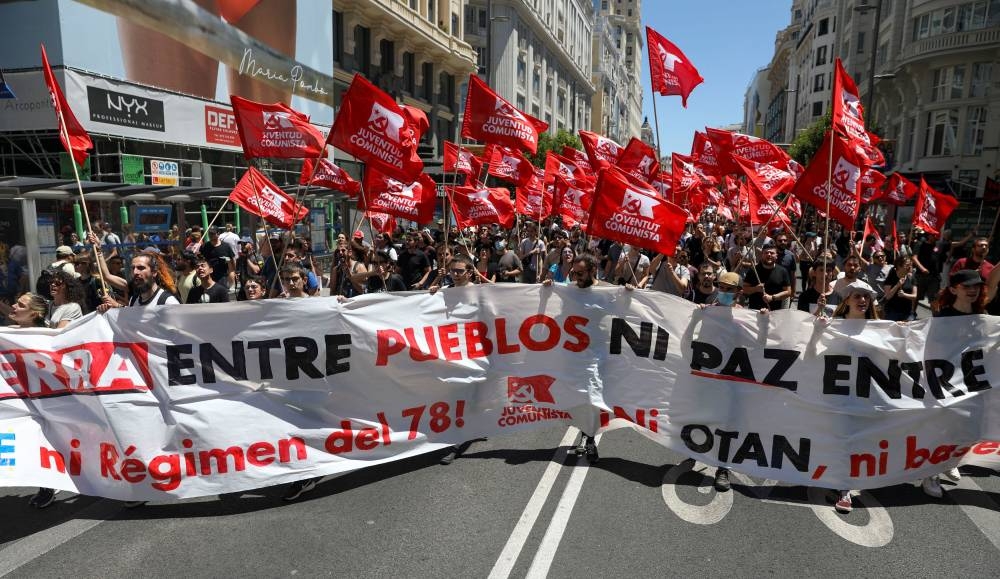 Demonstrators take part in an anti-Nato protest ahead of the Nato summit, which will be held on June 28 and June 30 in Madrid, Spain, June 26, 2022. — Reuters pic