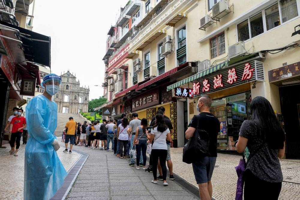 People queue for COVID-19 testing in Macau, China, June 20, 2022. — Reuters pic