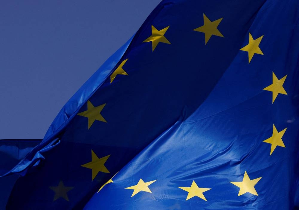 European Union flags flutter outside the EU Commission headquarters in Brussels June 17, 2022. — Reuters pic