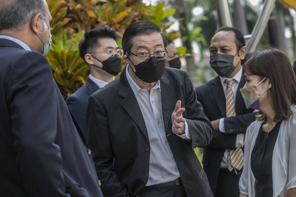 Former Penang chief minister Lim Guan Eng (centre) is pictured leaving the Kuala Lumpur High Court June 28, 2022. ― Picture by Hari Anggara