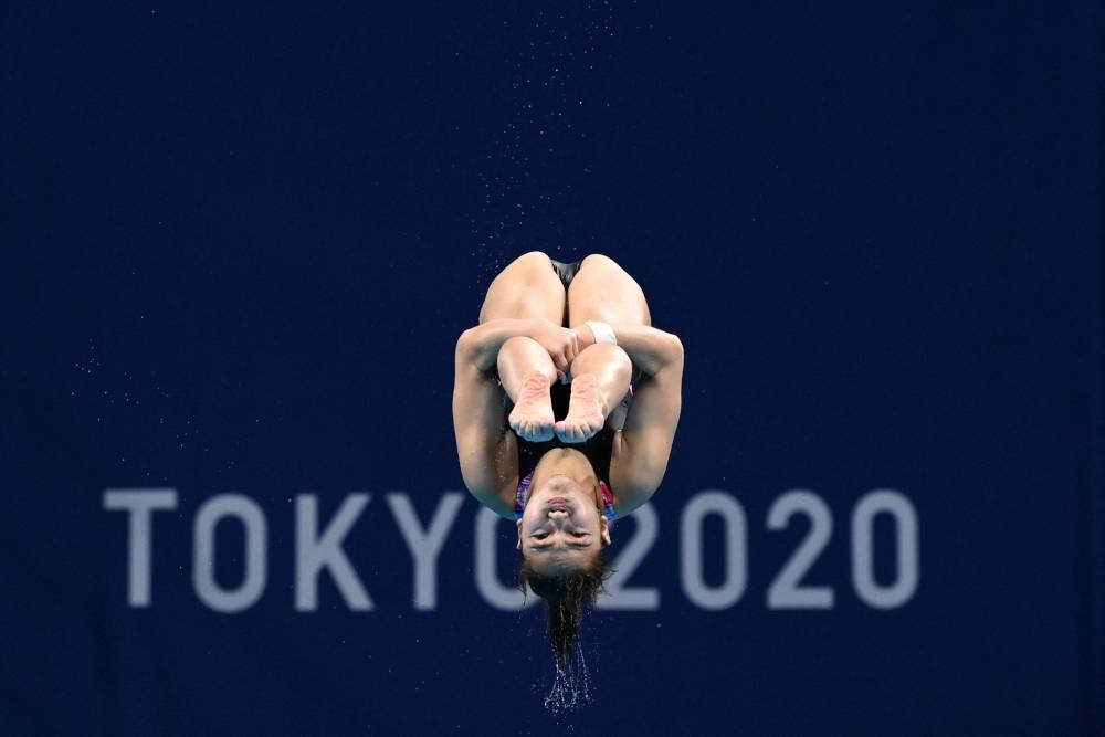 Malaysia’s Nur Dhabitah Sabri competes in the preliminary round of the women’s 3m springboard diving event during the Tokyo 2020 Olympic Games at the Tokyo Aquatics Centre in Tokyo July 30, 2021. — AFP pic