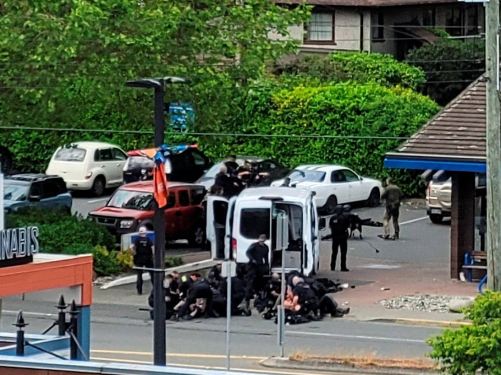 General view of the site where two armed suspects died and six police officers were shot, during an incident at a bank in Saanich, British Columbia, Canada June 28, 2022 in this picture obtained from social media. ― Joan B Flood/via Reuters