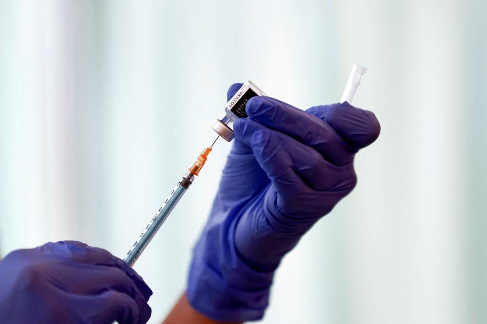 The FDA yesterday recommended Covid-19 vaccine manufacturers Pfizer Inc/BioNTech SE and Moderna Inc change the design of their booster shots beginning this fall to include components tailored to combat BA.4 and BA.5. It plans to review them for emergency use authorisation. ― Reuters file pic