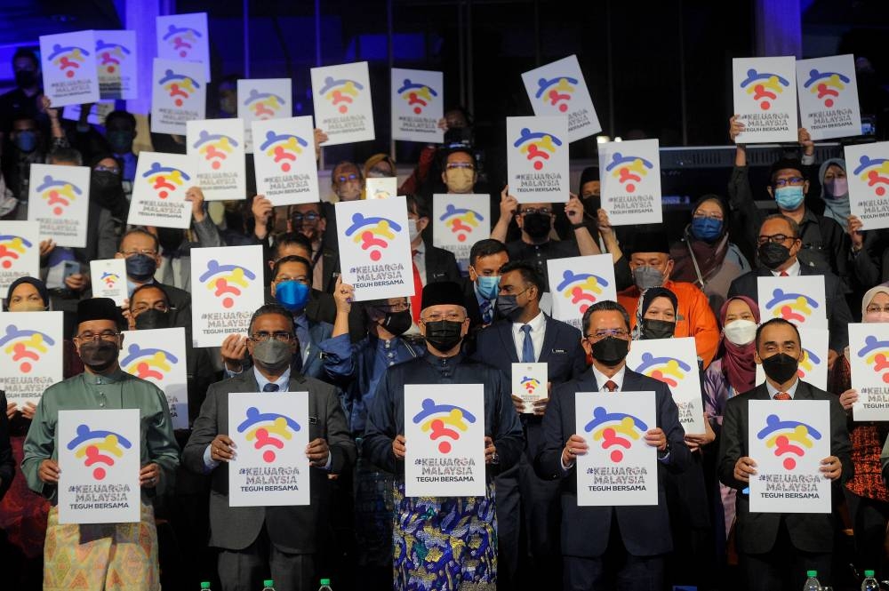 Tan Sri Annuar Musa (front row, centre) poses for the camera at the launching ceremony of the logo and theme for the 2022 National Day and Malaysia Day celebrations in Kuala Lumpur July 1, 2022. — Bernama pic