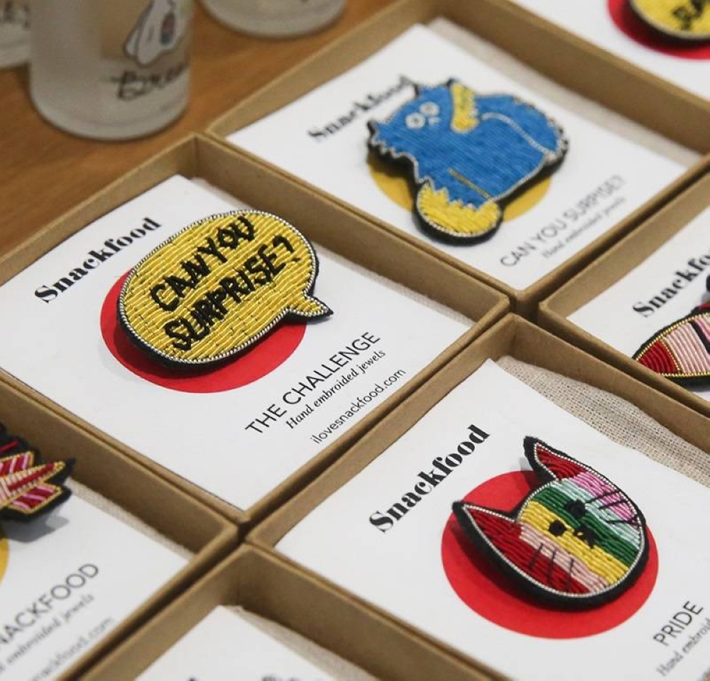 These pins are made to designs by Snackfood themselves.