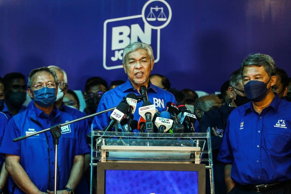 BN chairman Datuk Seri Ahmad Zahid Hamidi (center) speak to reporters at the press conference in Barisan Nasional command center Johor Umno Liaison Hall, Johor Baru March 12, 2022. —  Picture by Hari Anggara