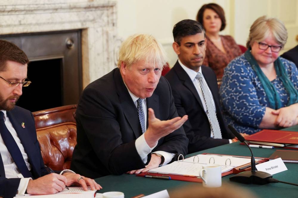 British Prime Minister Boris Johnson addresses his cabinet ahead of the weekly Cabinet meeting in Downing Street in London, Britain July 5, 2022. ― Ian Vogler/Pool via Reuters