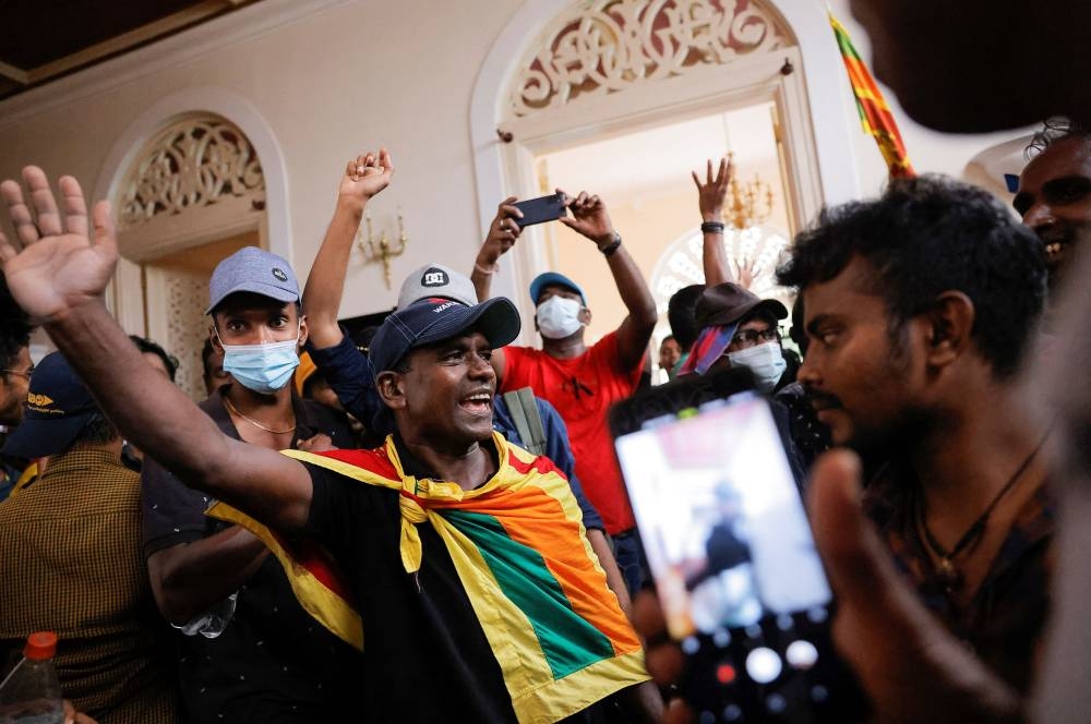 Demonstrators prDemonstrators protest inside the President’s House, after President Gotabaya Rajapaksa fled, amid the country’s economic crisis, in Colombo, Sri Lanka, July 9, 2022. ― Reuters pic