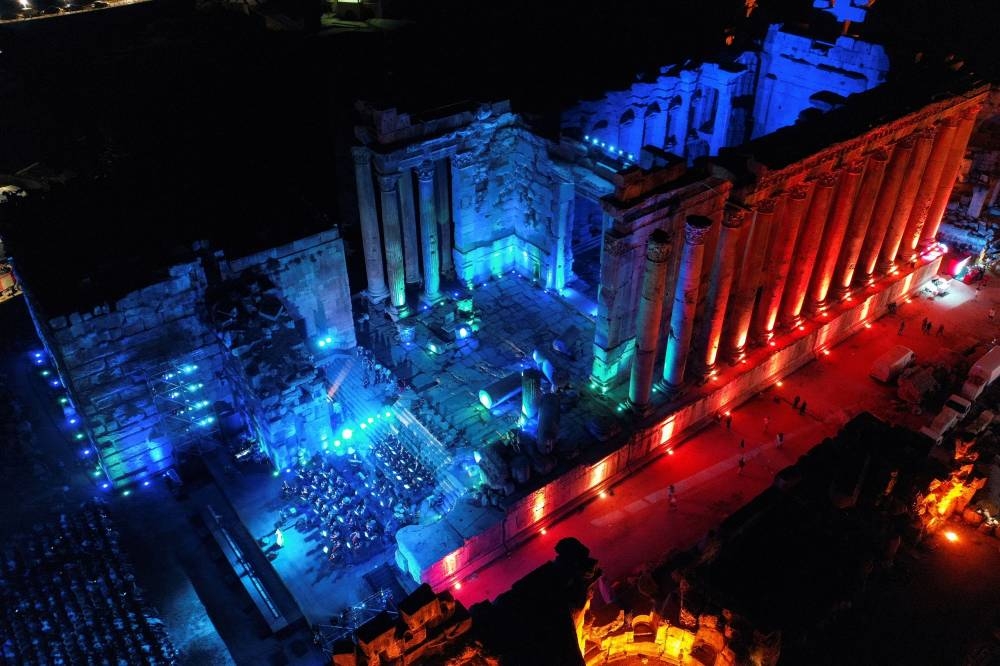 Lebanese singer Soumaya Baalbaki and conductor Lubnan Baalbaki perform at the Roman temple of Bacchus, during the opening of Baalbeck International Festival, in Baalbeck, Lebanon July 8, 2022. — Reuters pic