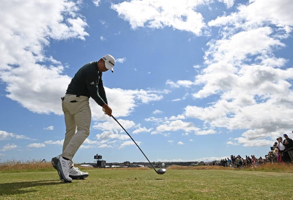 US golfer Collin Morikawa plays from the third tee during a practice round for The 150th British Open Golf Championship on The Old Course at St Andrews in Scotland, July 13, 2022. — AFP pic 