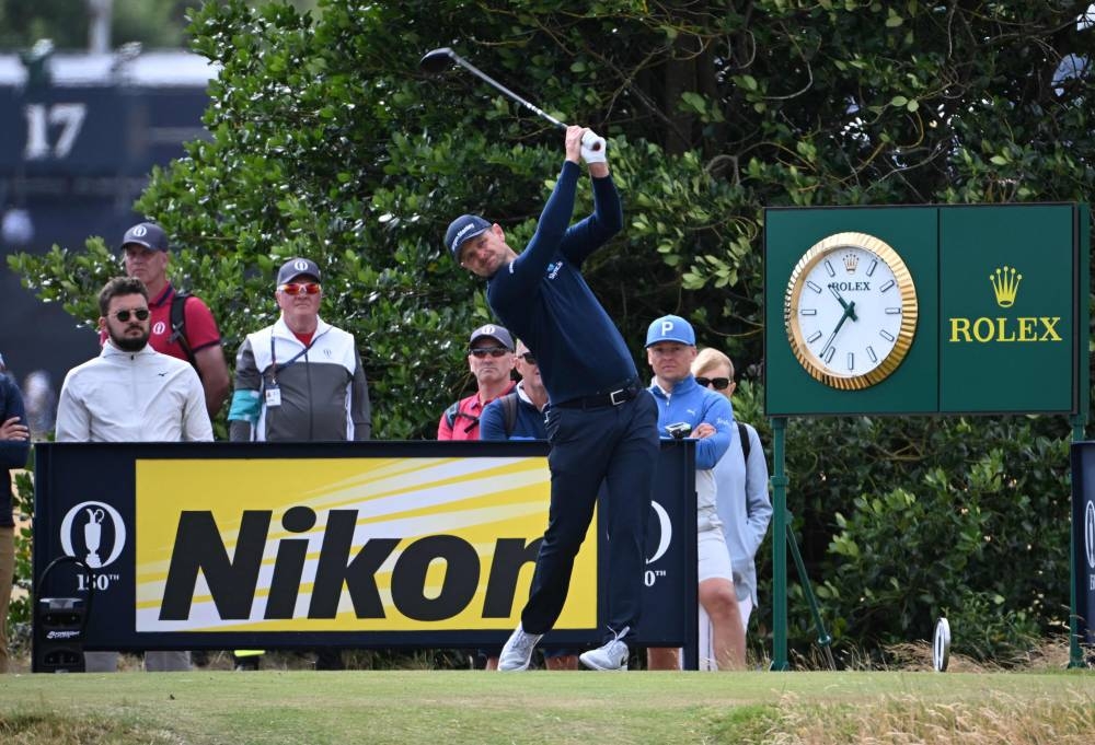 England’s Justin Rose plays from the third tee during a practice round for The 150th British Open Golf Championship on The Old Course at St Andrews in Scotland, July 13, 2022. — AFP pic 