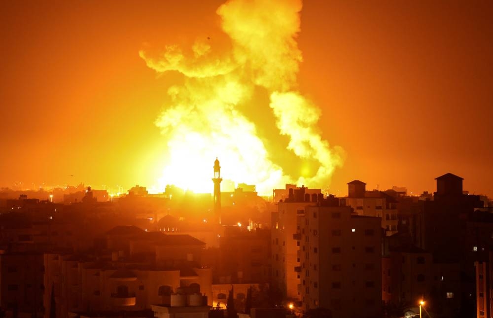 Fires are seen following an Israeli airstrike in Gaza city on July 16, 2022. — AFP pic