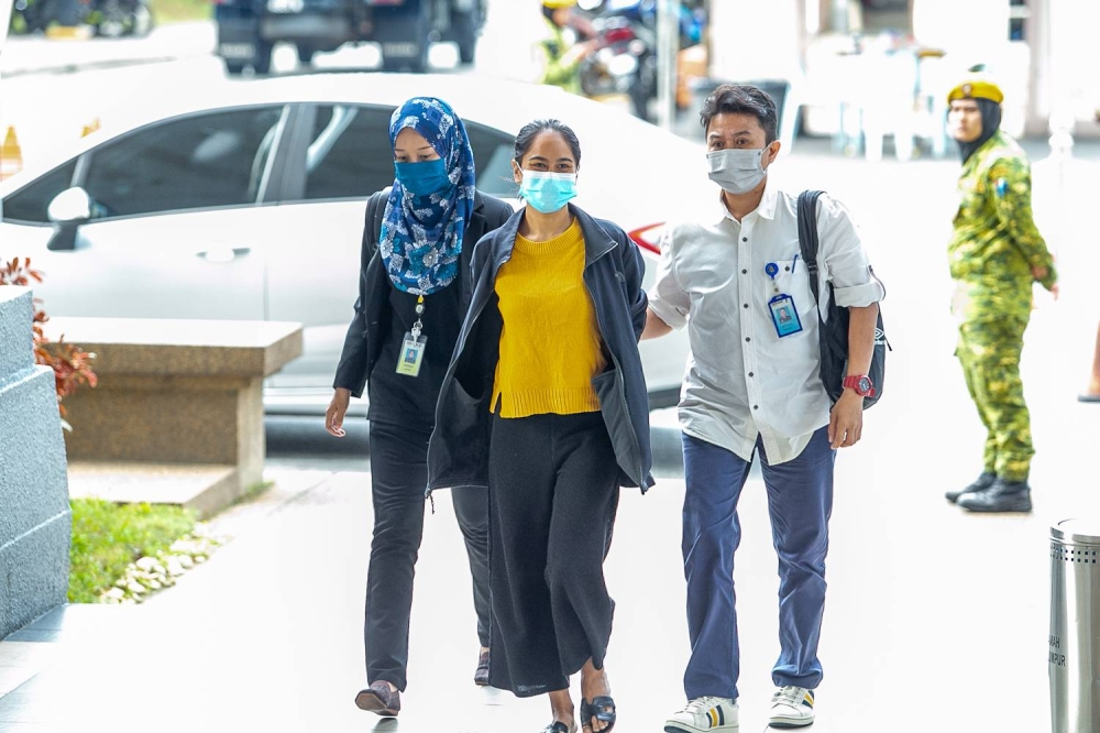 Siti Nuramira Abdullah arrives at the Kuala Lumpur High Court July 13, 2022. — Picture by Devan Manuel