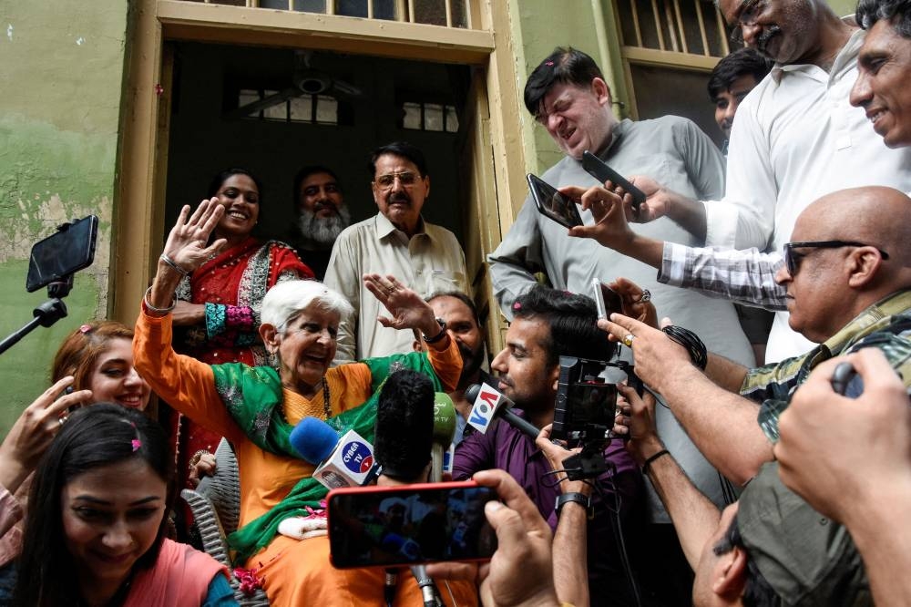 Reena Varma, 90-year-old Indian citizen born in Pakistan, gestures as she speaks with the members of the media outside her ancestral home while visiting after 75 years, in Rawalpindi, Pakistan July 20, 2022. — Reuters pic