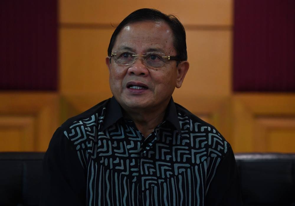 Agriculture and Food Industries Deputy Minister Datuk Seri Ahmad Hamzah speaks to the media after officiating at the 2022 Agriculture Department Innovation Day celebration in Putrajaya July 21, 2022. — Bernama pic