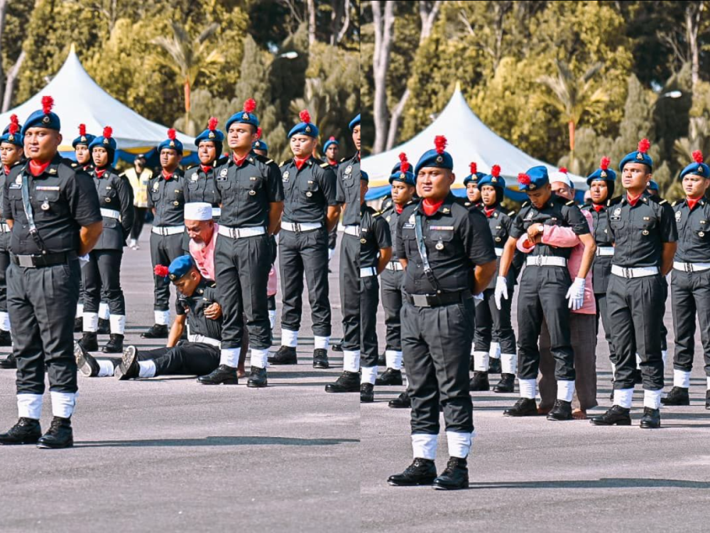 A local elderly man is being applauded for compassion and love after he was caught on camera rushing to his nephew’s aid who had fainted during a parade in Kajang yesterday. — Picture via Facebook/Alexander Nanta Linggi. 