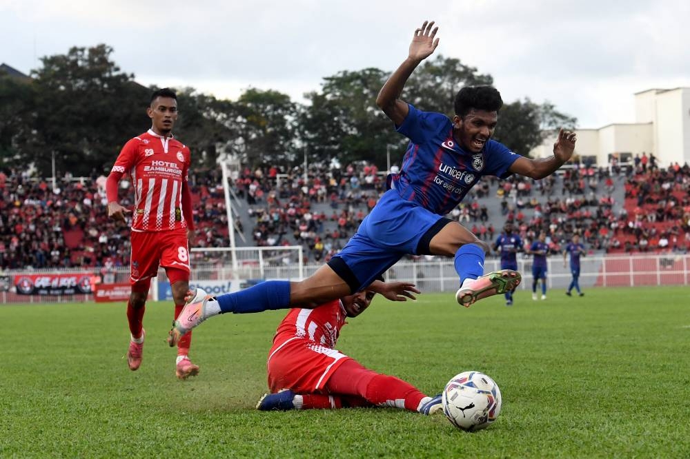 JDT II player Chia Ruo Han (right) in action during the Premier League match against Kelantan FC at Sultan Muhammad IV Stadium in Kota Baru July 22, 2022. — Bernama pic