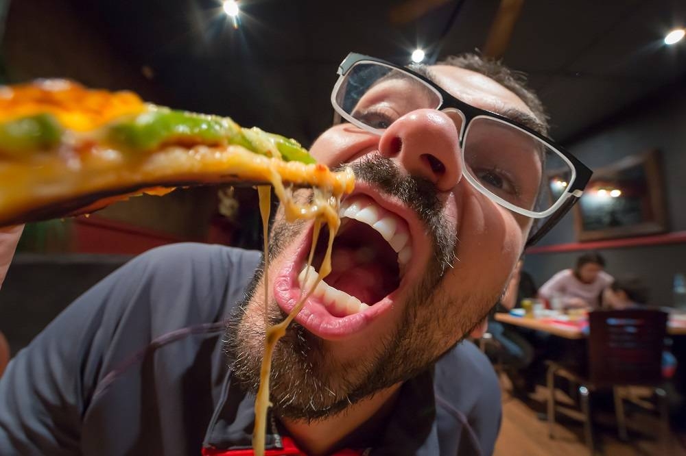 Could eating with your mouth open make food taste better? — ETX Studio pic