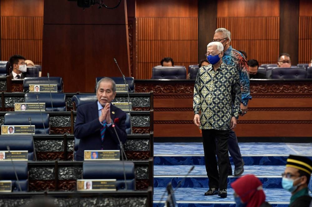 Prime Minister Datuk Seri Ismail Sabri Yaakob attends the Second Meeting of the Fifth Term of the 14th Parliament for the Dewan Rakyat at the Parliament, July 28, 2022. Also present is de facto law minister Datuk Seri Wan Junaidi Tuanku Jaafar. — Bernama pic 