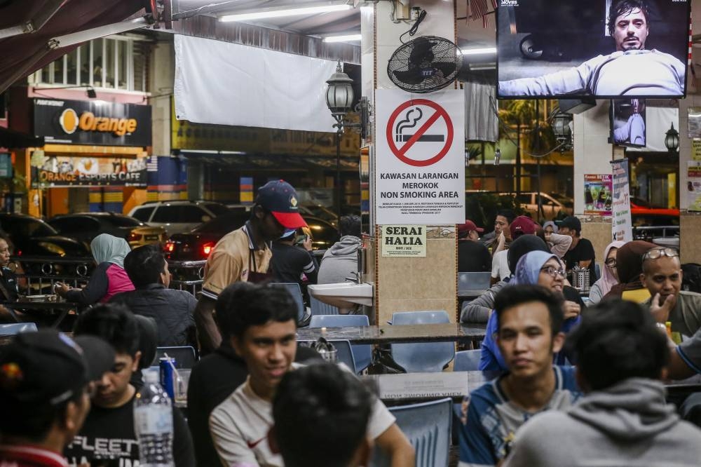 File picture of a no-smoking sign is seen in Restoran Ali Maju in Kuala Lumpur, January 1, 2019. The GEG Bill prohibits the sale of cigarettes or vape products as well as making available smoking services to those born after 2007. — Picture by Firdaus Latif