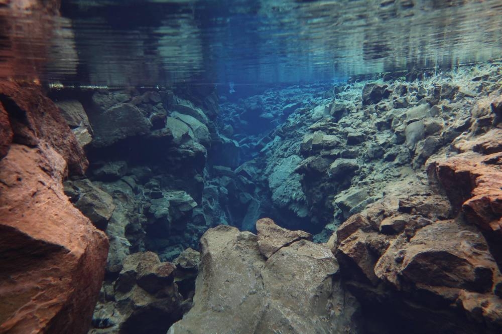 This handout picture taken underwater shows a ravine in the Silfra fissure on July 26, 2022 in Thingvellir, Iceland. — AFP pic