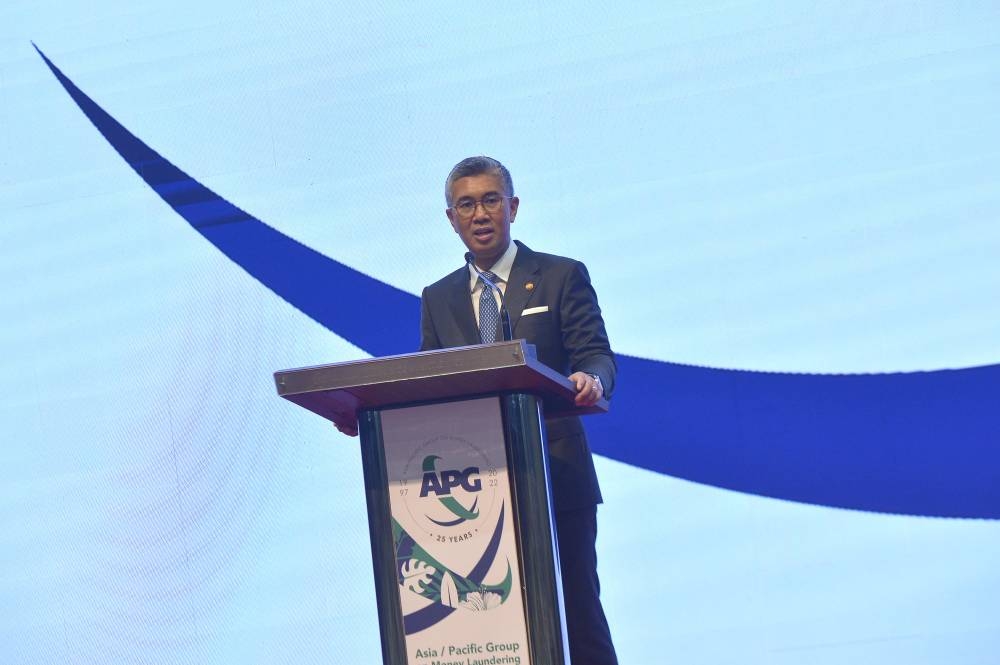 Finance Minister Datuk Seri Tengku  Zafrul Abdul Aziz delivers his speech during officiating the plenary session of the annual meeting for Asia-Pacific Group on Money Laundering (APG) 2022 in Kuala Lumpur Convention Centre July 26, 2022. — Picture by Shafwan Zaidon