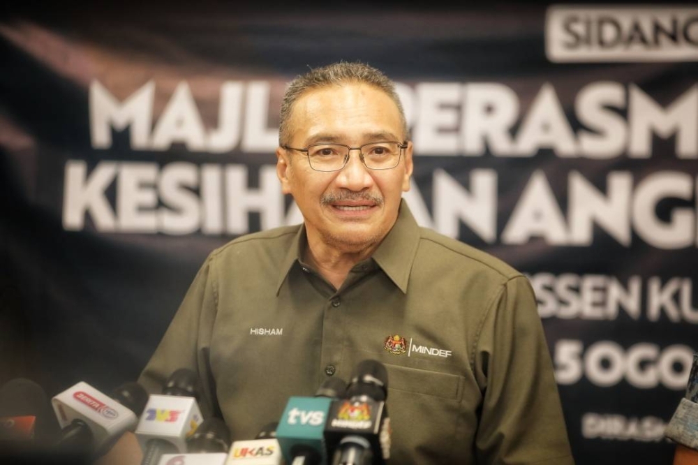 Defence Minister Datuk Seri Hishammuddin Hussein speaks to reporters at a press conference after the launch of a polyclinic at the army camp in Penrissen in Sarawak, August 5, 2022. — Borneo Post pic 