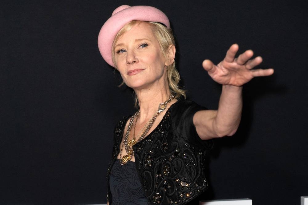 In this file photo taken on November 30, 2021, US actress Anne Heche arrives for the premiere of Netflix's 'The Unforgivable' at the Directors Guild of America in Los Angeles. - US actress Anne Heche has been hospitalised in critical condition after crashing her car into a Los Angeles home, US media reported Friday. — AFP pic