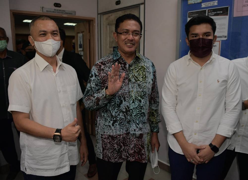 The Sessions Court in Johor Baru acquitted former Johor Exco Datuk Abdul Latif Bandi, his son Ahmad Fauzan Hatim Abd Latif (right) and real estate consultant Amir Sharifuddin Abd Raub (left), August 7, 2022 on charges of corruption and money laundering. all amounting to RM35.7 million, five years ago. — Bernama pic