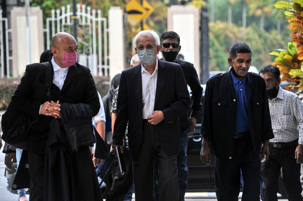 Former Felda chairman Tan Sri Shahrir Ab Samad (centre) at the Kuala Lumpur Court Complex today, August 10, 2022. — Bernama pic 