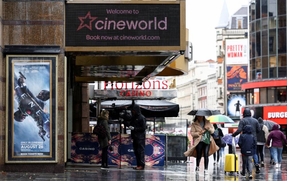 People walk past a Cineworld in Leicester's Square in London, Britain, October 4, 2020. ― Reuters file pic