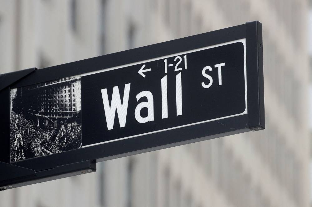 The Wall Street sign is seen near the New York Stock Exchange in New York City, May 4, 2021. — Reuters pic