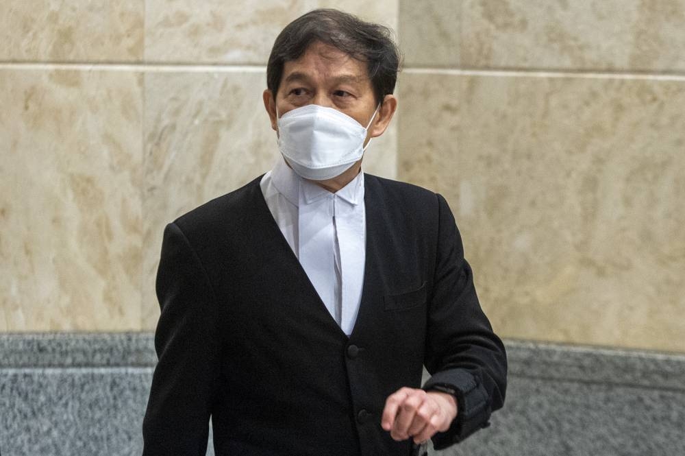 Lawyer Hisyam Teh Poh Teik is seen at the Palace of Justice in Putrajaya August 18, 2022. — Picture by Shafwan Zaidon