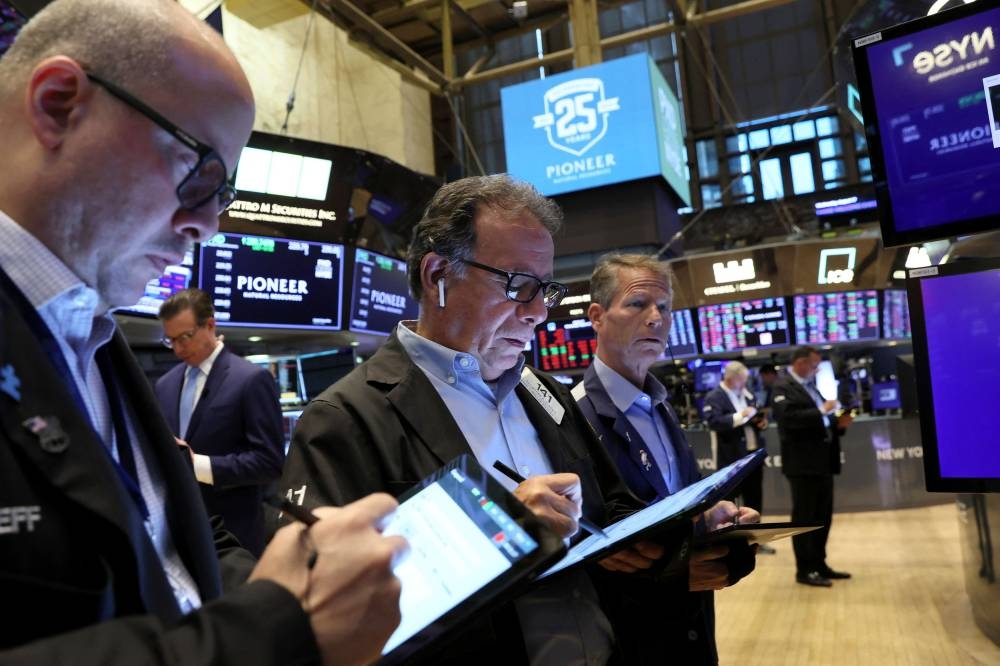 Traders work on the floor of the New York Stock Exchange in New York City August 17, 2022. — Reuters pic 