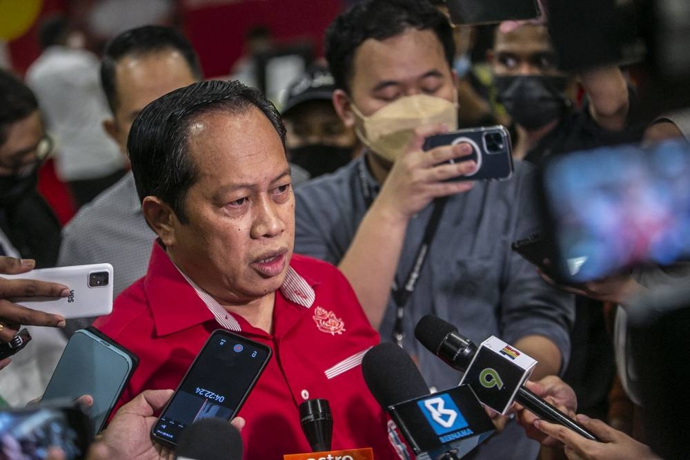 Umno secretary-general Datuk Seri Ahmad Maslan speaks to reporters at Umno headquarters Kuala Lumpur June 24, 2022. — Picture by Hari Anggara