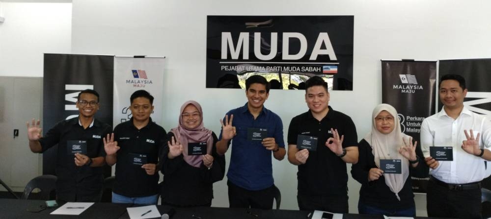 From right: Muda information chief Luqman Long, Faezrah who is also Muda Sabah’s deputy chairman, Amos, Muda president Syed Saddiq Syed Abdul Rahman, Muda deputy president Amira Aisya, Muda vice president Shahrizal Denci Ahmad Zarul Hafiq. — Borneo Post pic 