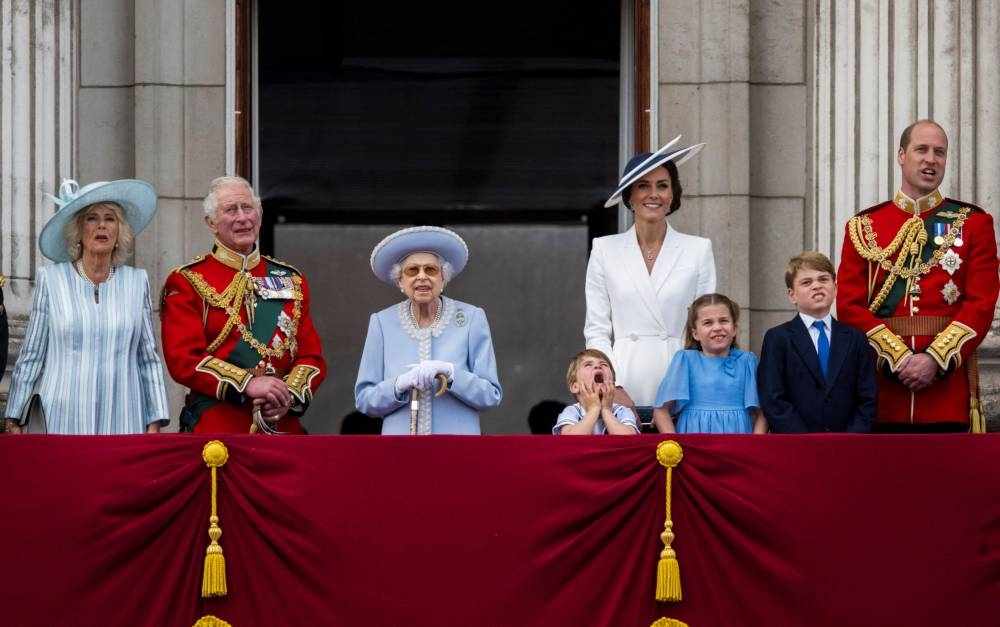 Britain's Queen Elizabeth along with members of the Royal Family watches the special flypast by Britain's RAF (Royal Air Force) from Buckingham Palace balcony following the Trooping the Colour parade, as a part of her platinum jubilee celebrations, in London, Britain June 2, 2022. — Paul Grover/Pool via Reuters