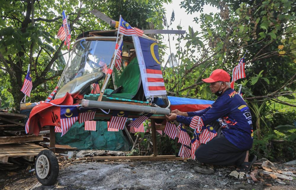 Taza said the materials he used were made up of mostly discarded items such as car tyres and pieces of wood. — Picture by Farhan Najib