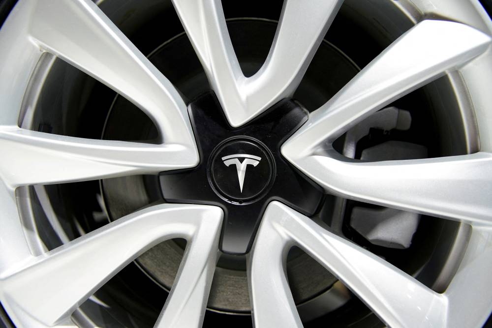 A Tesla logo is seen on a wheel rim during the media day for the Shanghai auto show in Shanghai April 16, 2019. — Reuters pic