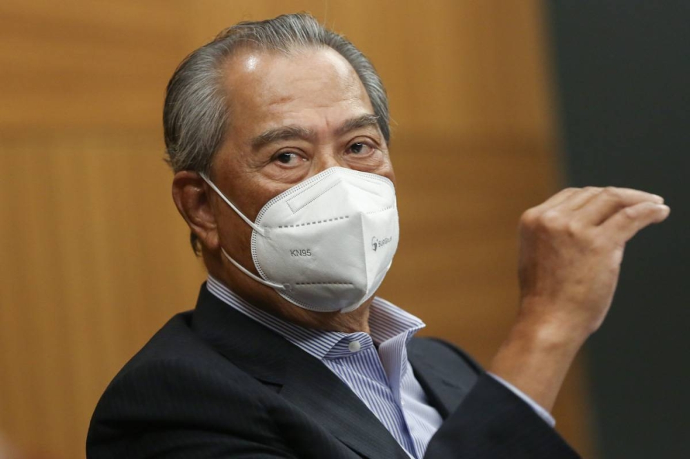 File picture shows Tan Sri Muhyiddin Yassin speaking during a press conference at Pullman Hotel in Kuching December 15, 2021. — Picture by Yusof Mat Isa