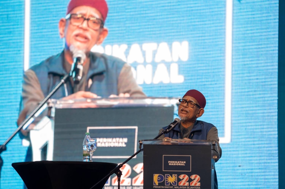 Datuk Seri Abdul Hadi Awang speaks during the Perikatan National convention at the Malaysia Agro Exposition Park, Serdang August 27, 2022. — Picture by Devan Manuel