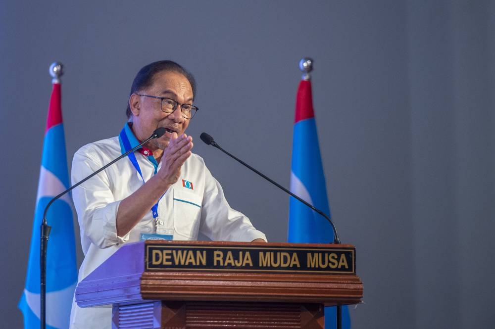 PKR president, Anwar Ibrahim delivers his speech during the PKR Election Convention in Shah Alam on 27 August 2022. — Picture by Shafwan Zaidon