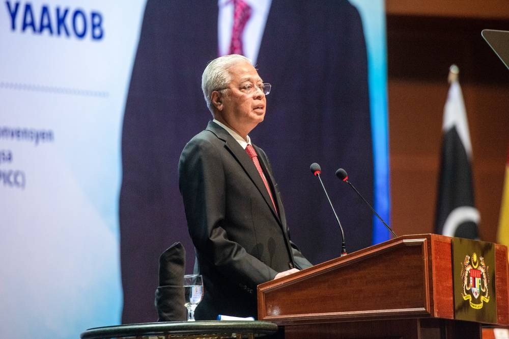 Prime Minister Datuk Seri Ismail Sabri Yaakob delivers his speech during a gathering with civil servants at the Putrajaya International Convention Centre August 30, 2022. — Picture by Shafwan Zaidon